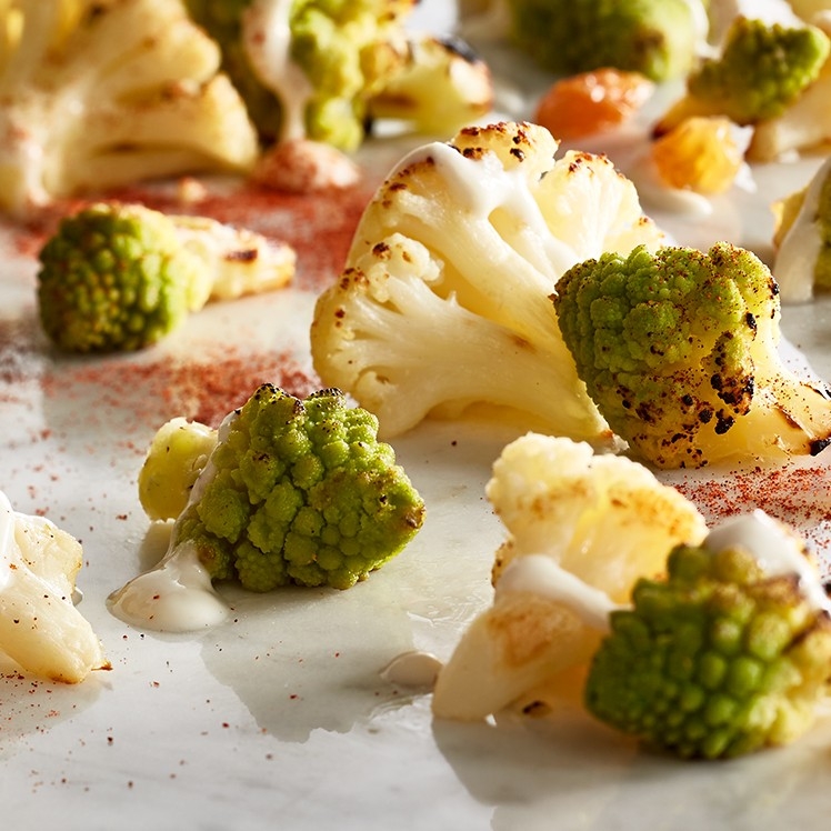 Roasted Romanesco and Cauliflower with Tahini and Golden Raisins