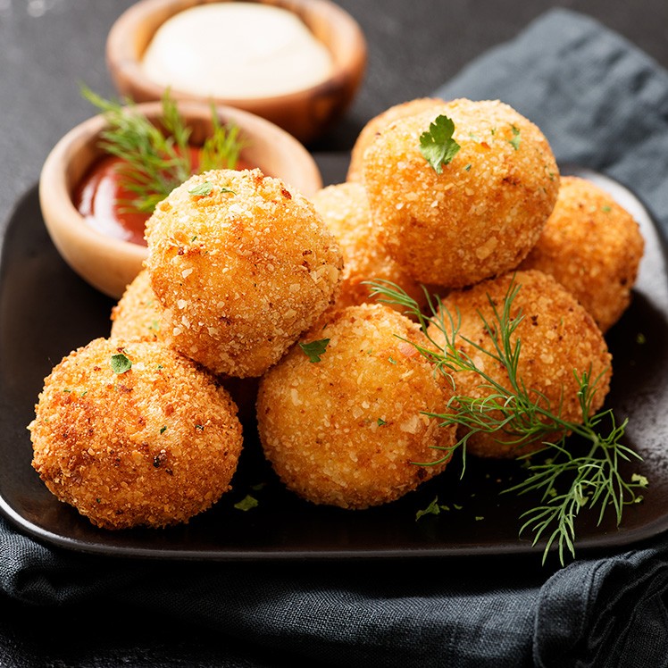 Beef Tallow-Fried Bacon Potato Croquettes with Herb Ranch Dressing 