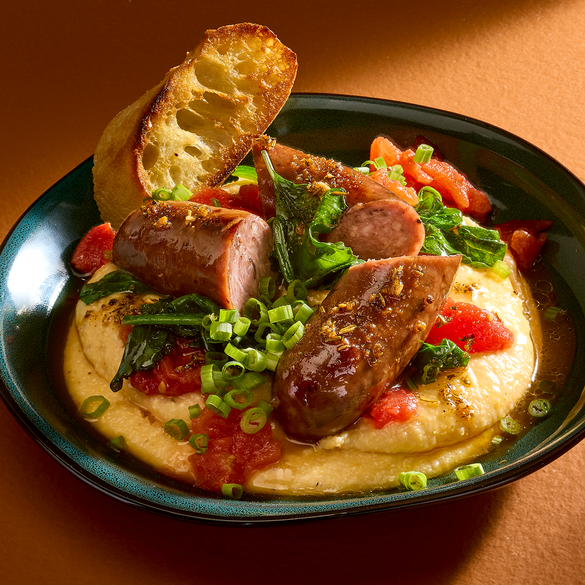 Black Forest Sausage with Cheddar Grits & Collard Greens