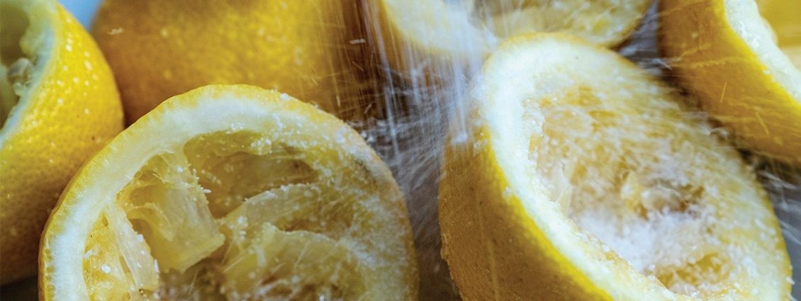 photo of lemons with salt over them